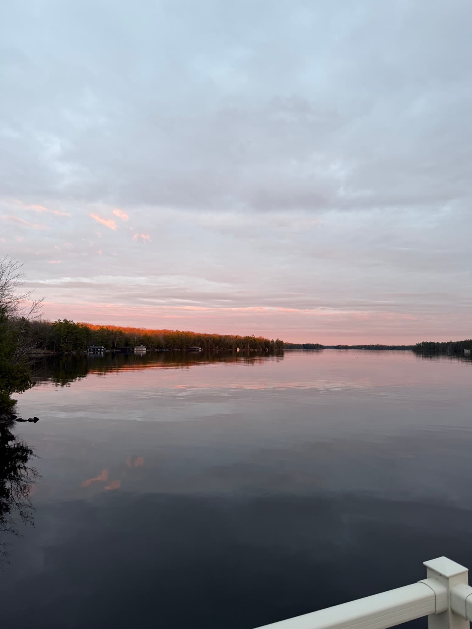Sunset over a calm Canadian lake